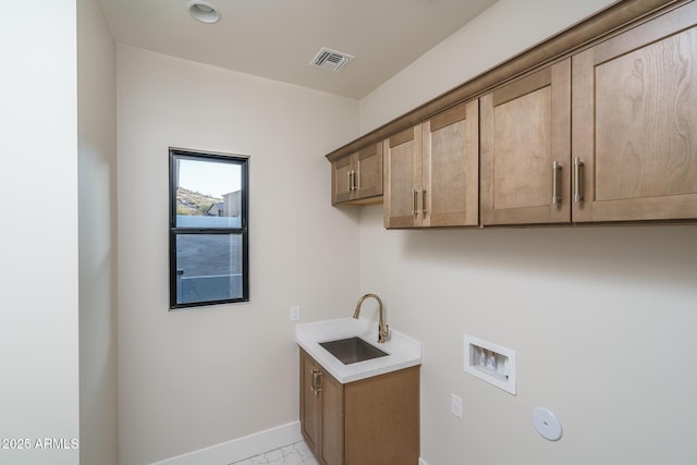 laundry room with cabinets, gas dryer hookup, sink, and washer hookup