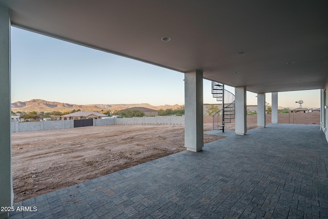 patio terrace at dusk with a mountain view