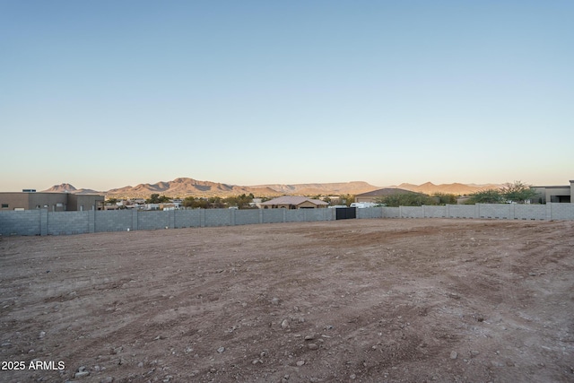 yard at dusk with a mountain view