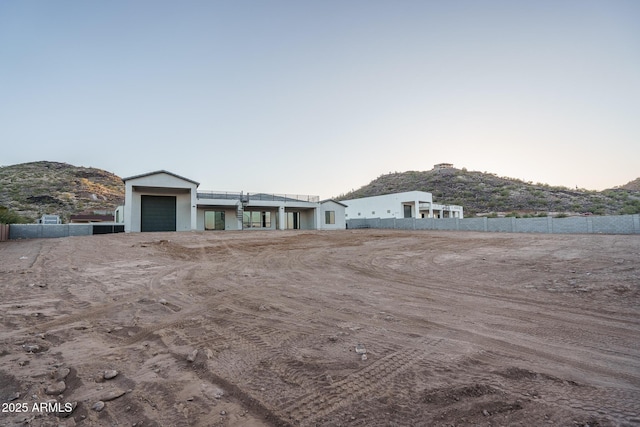 ranch-style house featuring a mountain view and a garage