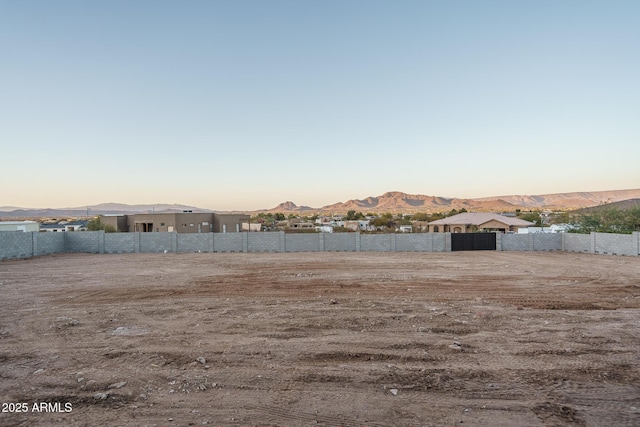 yard at dusk with a mountain view