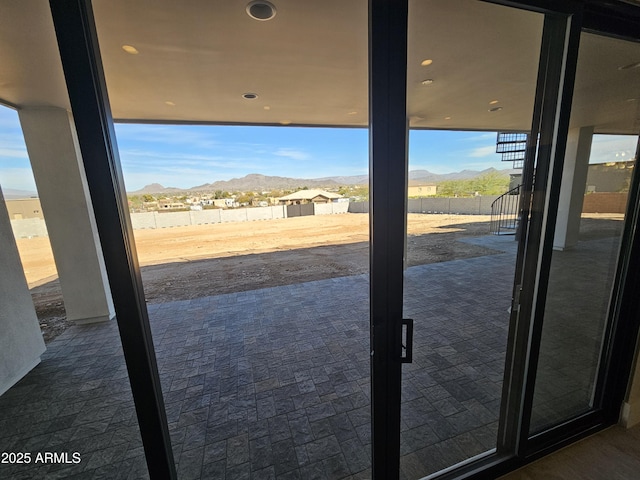 doorway to outside with a mountain view