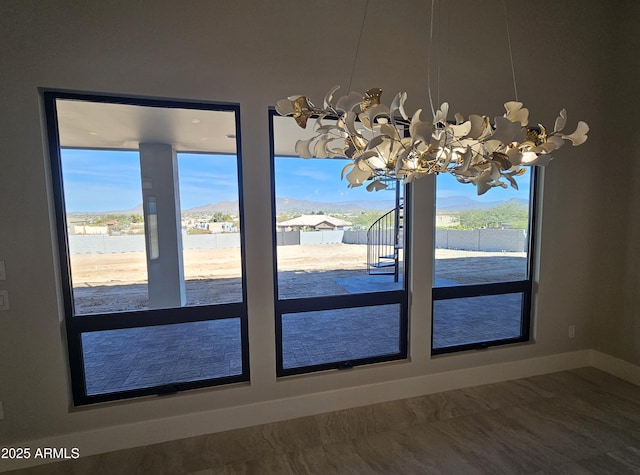 unfurnished dining area with a mountain view