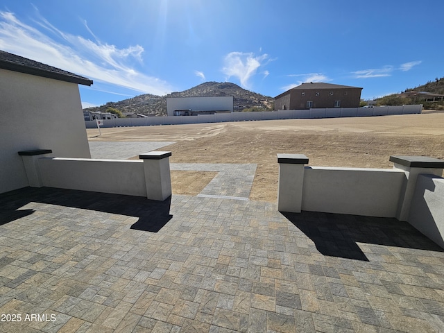 view of patio / terrace featuring a mountain view