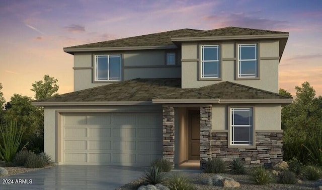 prairie-style house featuring a garage