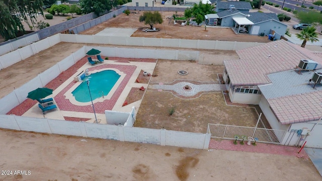 bird's eye view with central AC and a patio area