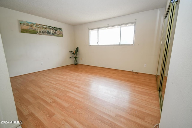 spare room featuring light hardwood / wood-style flooring