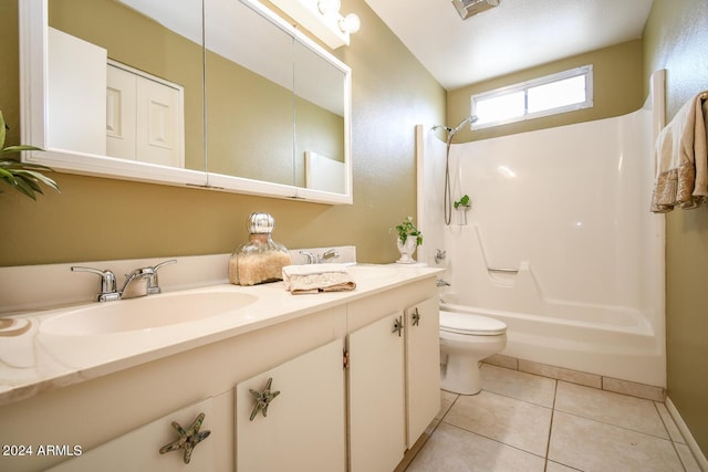 full bathroom with tile patterned flooring, bathing tub / shower combination, vanity, and toilet