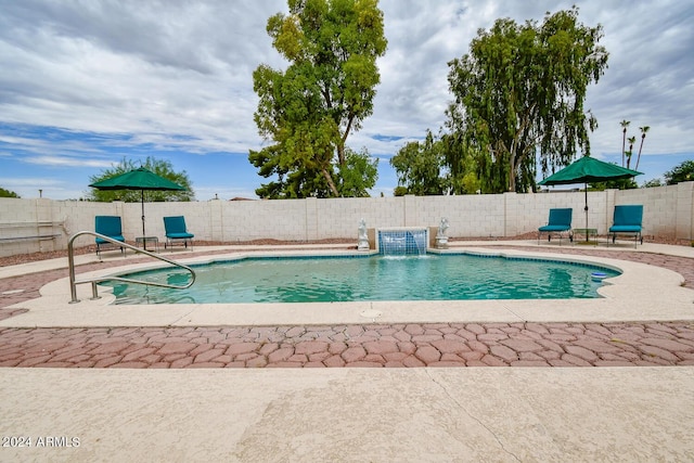 view of swimming pool featuring a patio area and pool water feature