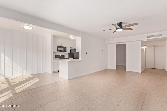 unfurnished living room with ceiling fan and light tile patterned floors