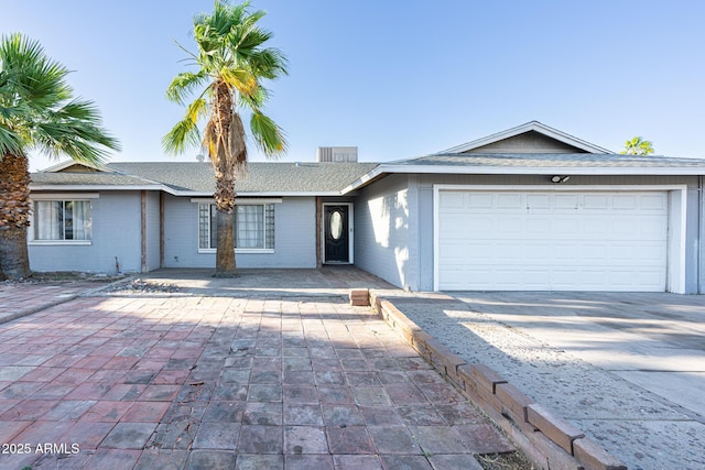 4628 W Solano Dr S, Glendale, AZ 85301 - ranch-style home with an attached garage, driveway, and a shingled roof