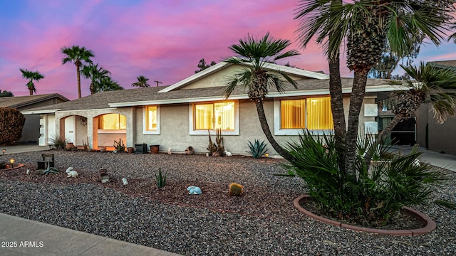 single story home featuring stucco siding