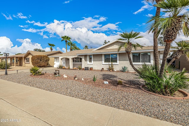 ranch-style home with stucco siding