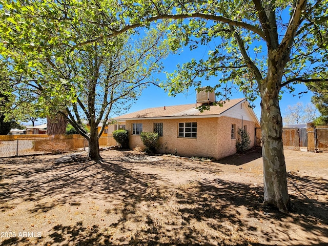 1374 S Naco Hwy, Bisbee, AZ 85603 - back of house with fence and a chimney