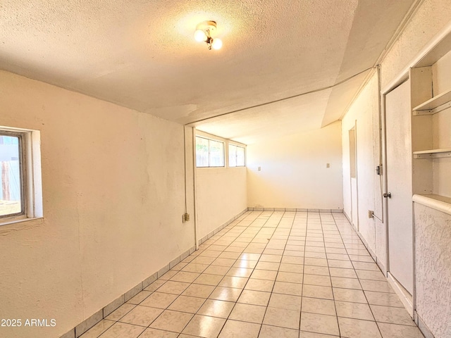 1374 S Naco Hwy, Bisbee, AZ 85603 - unfurnished room featuring a textured ceiling and light tile patterned floors