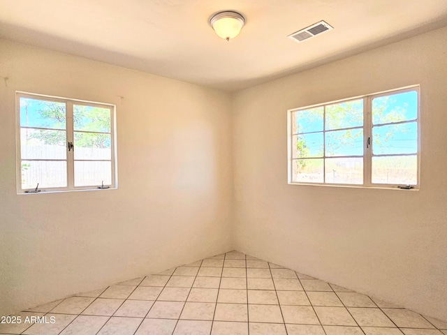1374 S Naco Hwy, Bisbee, AZ 85603 - empty room with plenty of natural light and light tile patterned floors
