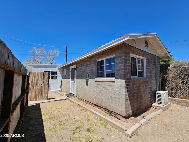 1374 S Naco Hwy, Bisbee, AZ 85603 - view of home's exterior featuring ac unit and fence
