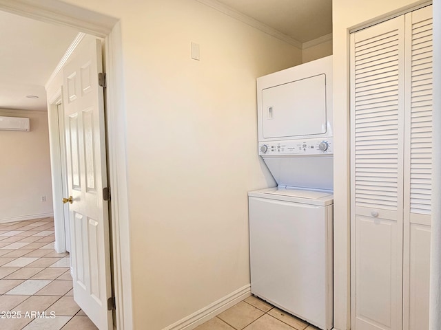 1374 S Naco Hwy, Bisbee, AZ 85603 - washroom with stacked washing machine and dryer, light tile patterned floors, a wall mounted AC, crown molding, and baseboards