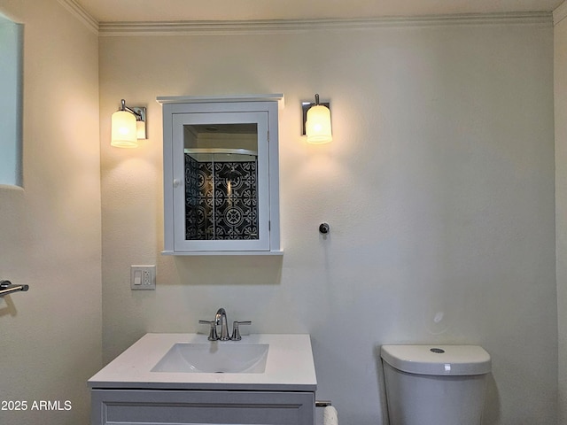 1374 S Naco Hwy, Bisbee, AZ 85603 - bathroom featuring vanity, ornamental molding, and toilet