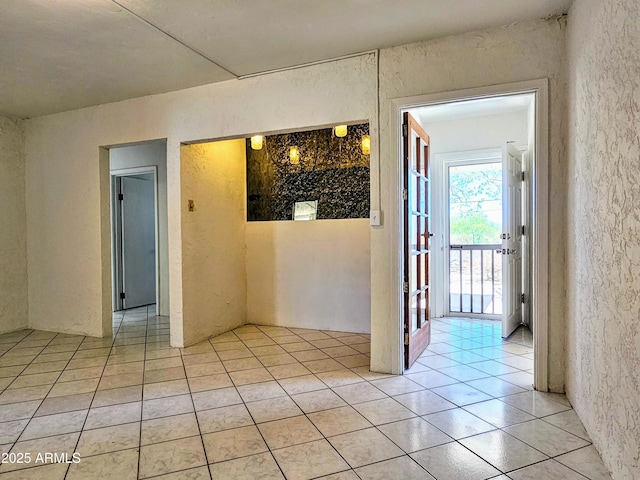 1374 S Naco Hwy, Bisbee, AZ 85603 - spare room featuring a textured wall and light tile patterned floors