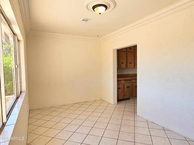 1374 S Naco Hwy, Bisbee, AZ 85603 - empty room featuring crown molding and light tile patterned flooring