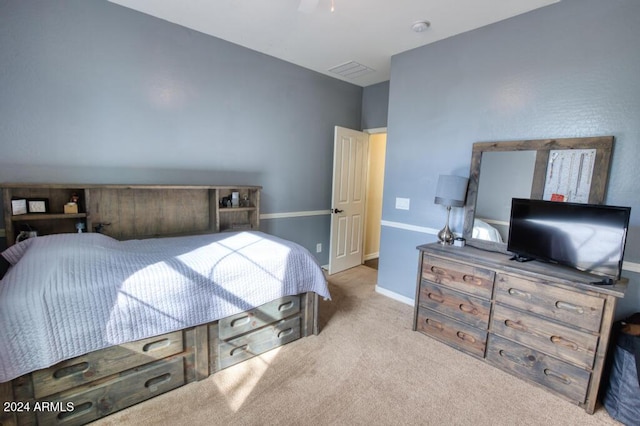 bedroom with light colored carpet