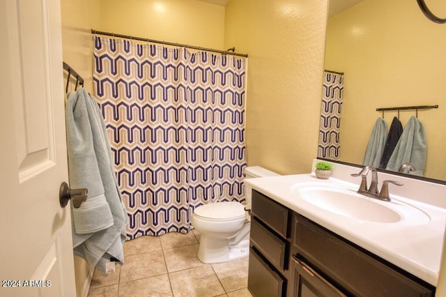 bathroom with tile patterned floors, vanity, and toilet