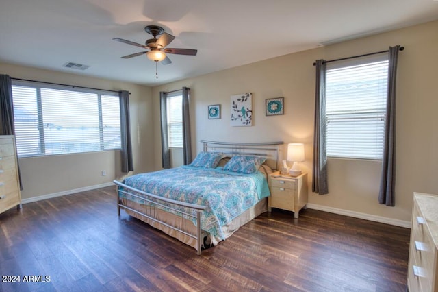 bedroom featuring ceiling fan and dark wood-type flooring