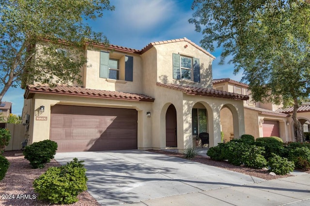 mediterranean / spanish-style home featuring a garage