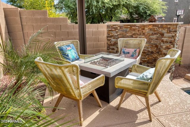 view of patio / terrace featuring a fire pit