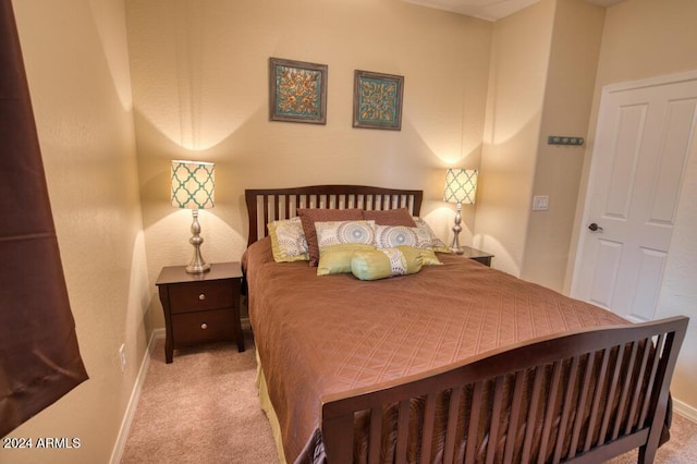 bedroom featuring light colored carpet