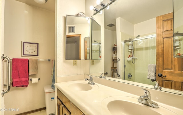 bathroom featuring vanity and an enclosed shower