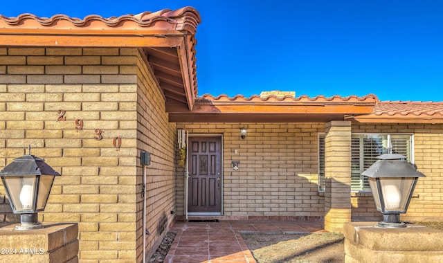 entrance to property with a patio area