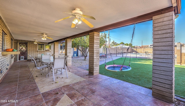 view of patio / terrace featuring ceiling fan