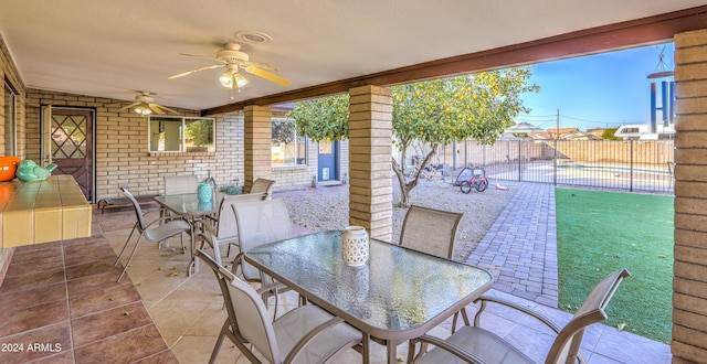 view of patio / terrace featuring ceiling fan