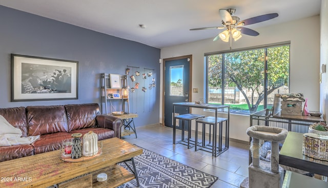 tiled living room featuring ceiling fan