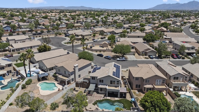 13160 W Windsor Ave, Goodyear, AZ 85395 - aerial perspective of suburban area featuring a pool and a mountainous background