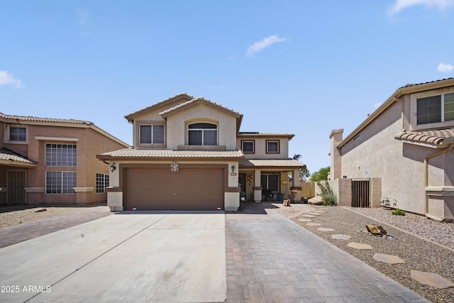 13160 W Windsor Ave, Goodyear, AZ 85395 - mediterranean / spanish-style house featuring stucco siding, concrete driveway, an attached garage, and a tiled roof