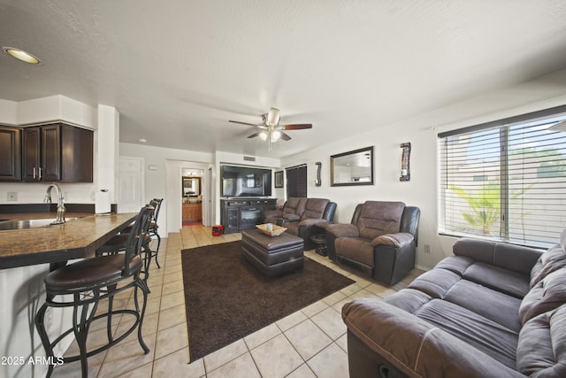 13160 W Windsor Ave, Goodyear, AZ 85395 - living area with light tile patterned flooring and ceiling fan