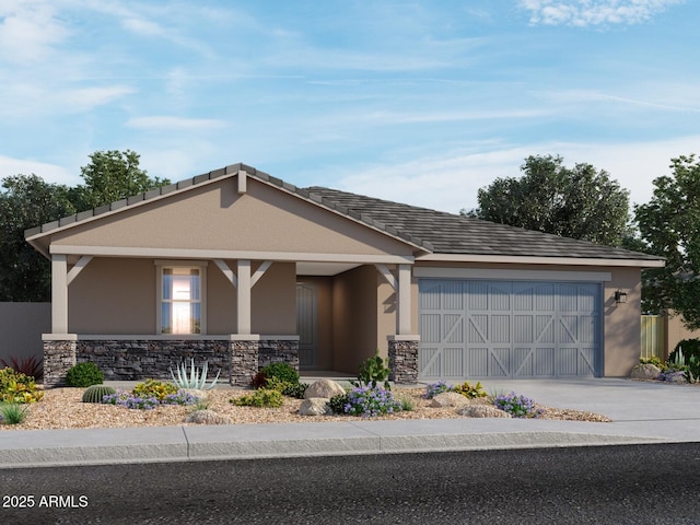 17609 W Pierson St, Goodyear, AZ 85395 - view of front facade featuring driveway, stone siding, covered porch, an attached garage, and stucco siding