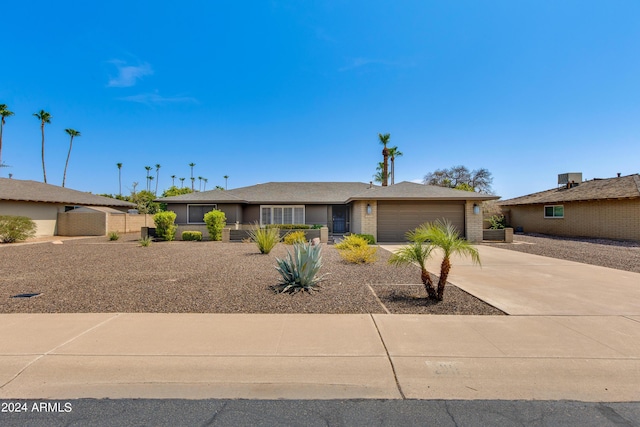 single story home featuring a garage