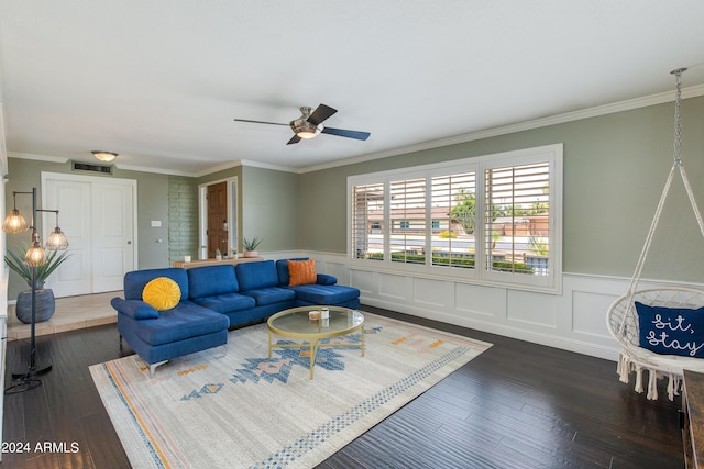 living room featuring ceiling fan, dark wood-type flooring, and ornamental molding