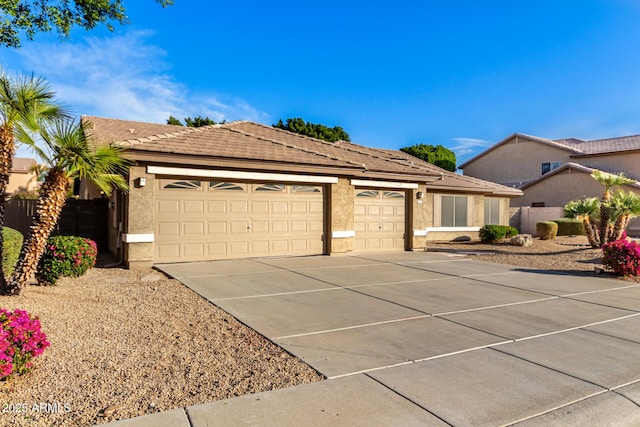 ranch-style home with a garage