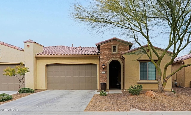 mediterranean / spanish home with a garage