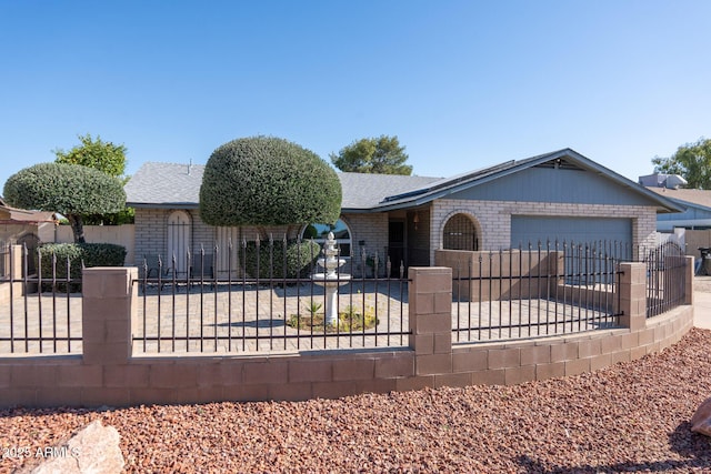 3833 W Phelps Rd, Phoenix, AZ 85053 - ranch-style house featuring a fenced front yard, brick siding, an attached garage, and roof with shingles