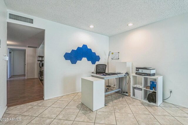 3833 W Phelps Rd, Phoenix, AZ 85053 - office featuring a textured ceiling, light tile patterned floors, recessed lighting, and baseboards