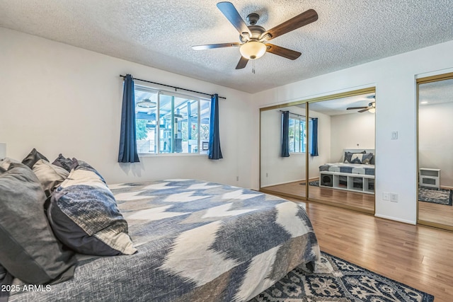 3833 W Phelps Rd, Phoenix, AZ 85053 - bedroom featuring wood finished floors, a textured ceiling, and ceiling fan