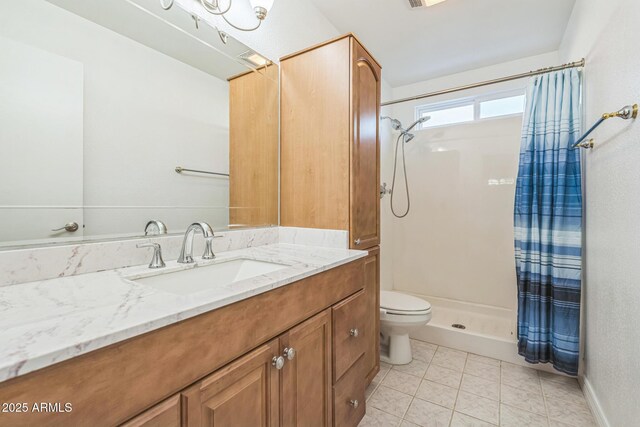 3833 W Phelps Rd, Phoenix, AZ 85053 - full bathroom with a shower stall, toilet, vanity, and tile patterned flooring