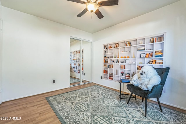 3833 W Phelps Rd, Phoenix, AZ 85053 - sitting room with ceiling fan, wood finished floors, and baseboards