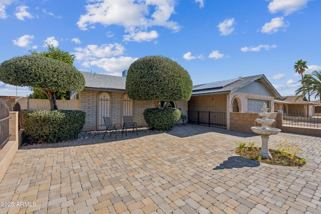 3833 W Phelps Rd, Phoenix, AZ 85053 - single story home featuring brick siding and roof mounted solar panels